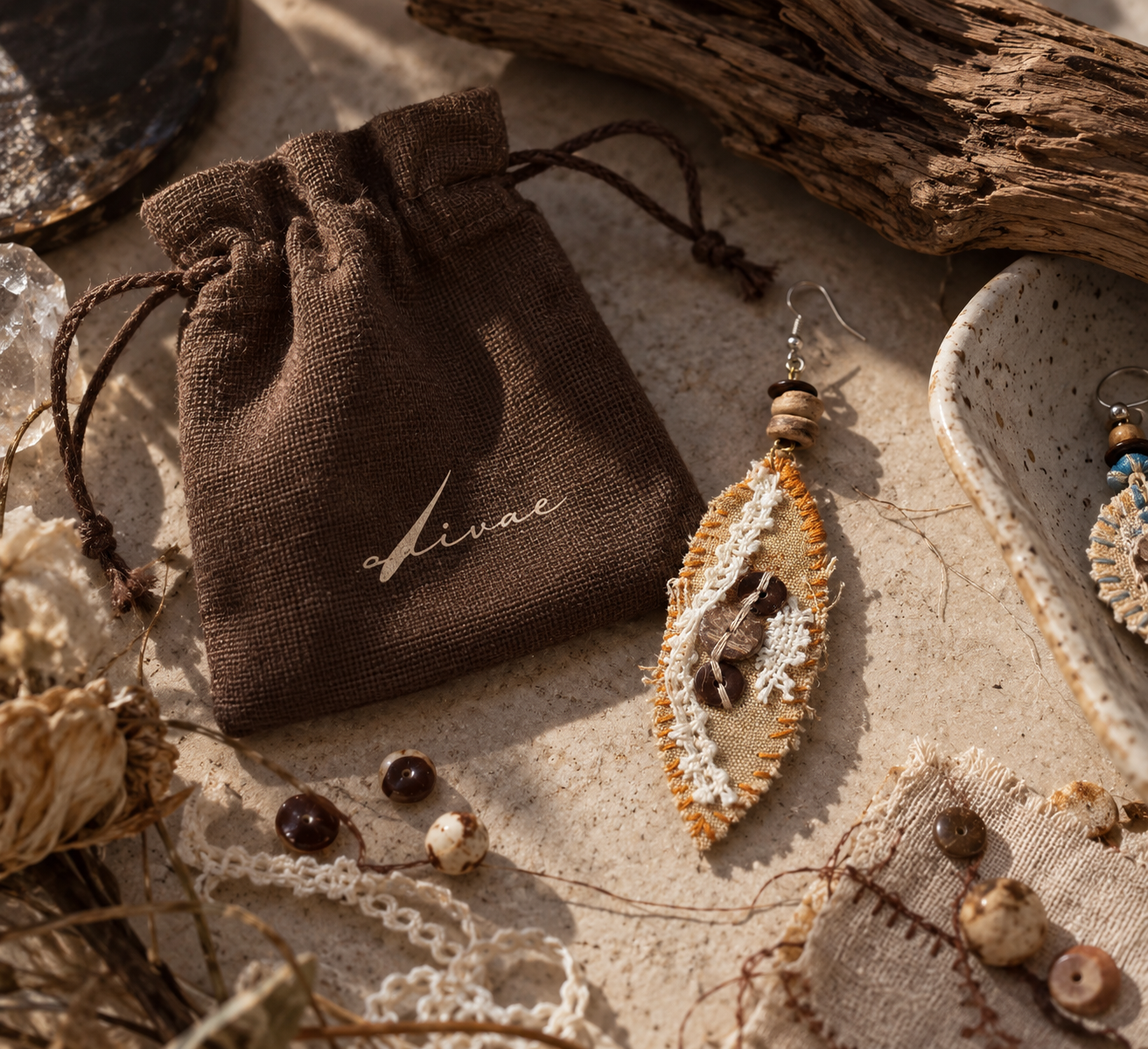Livae jewelry with a natural fabric pouch