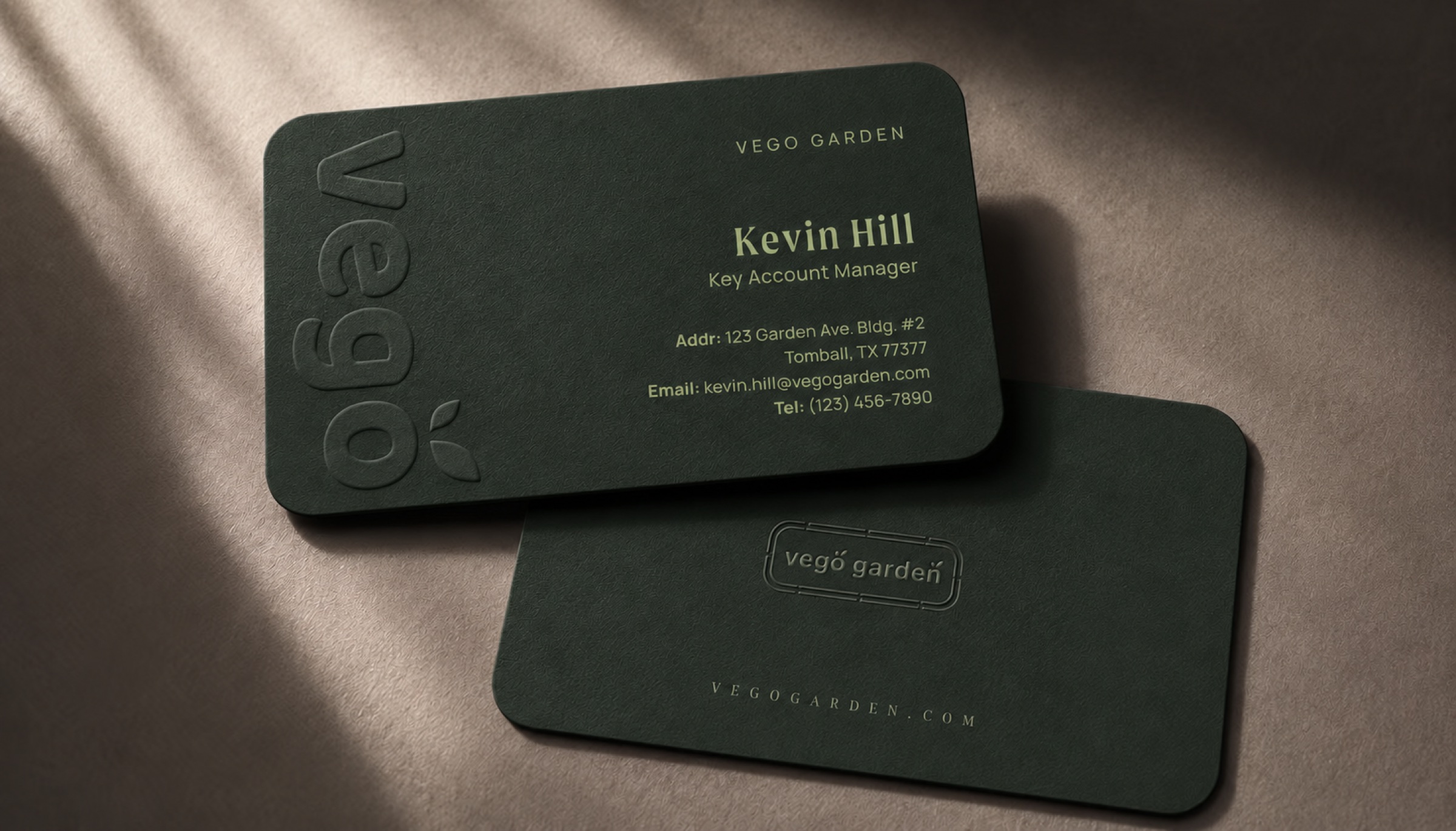 Embossed dark green Vego Garden business cards