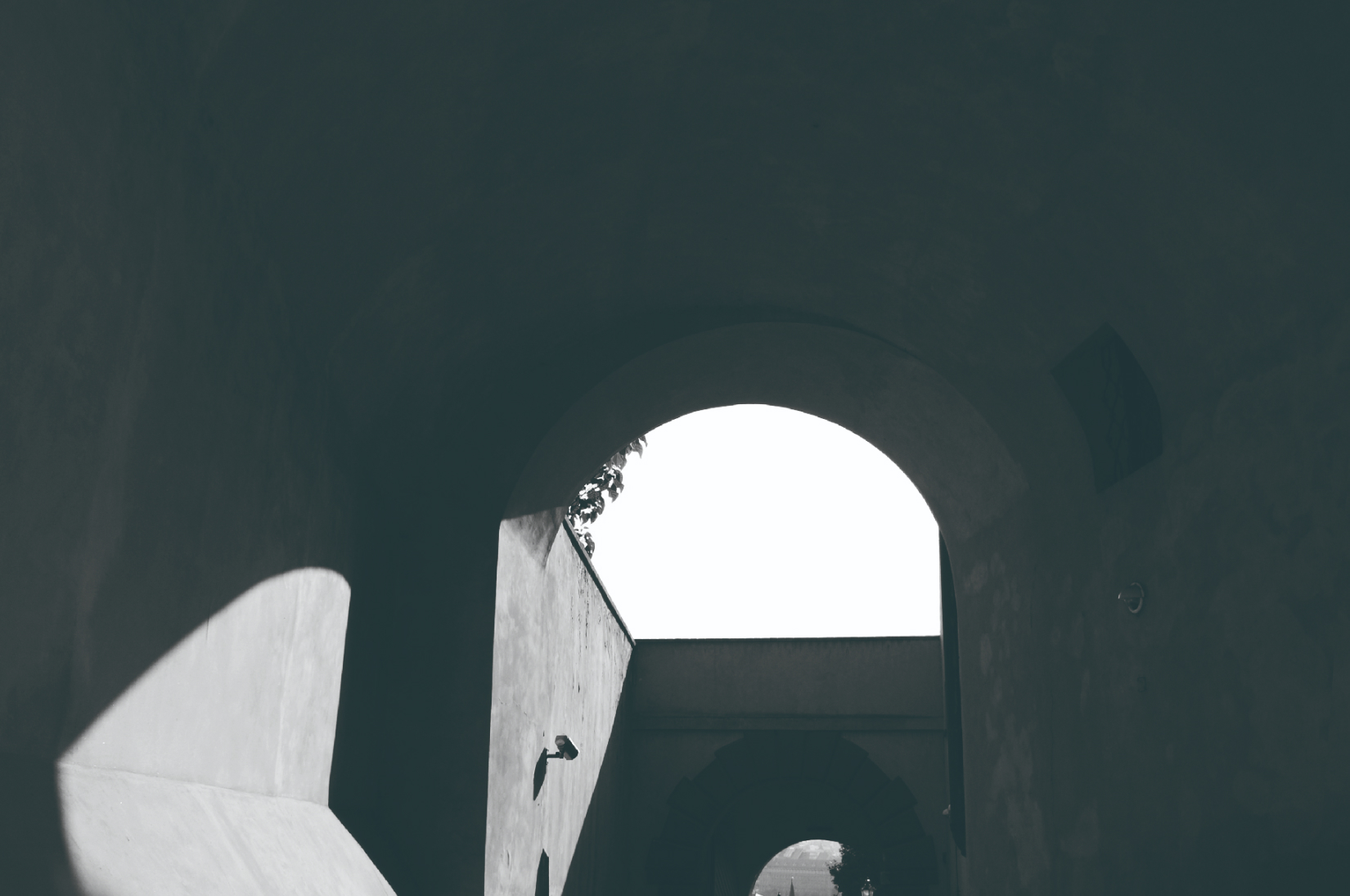 Light and shadow inside an arched passage